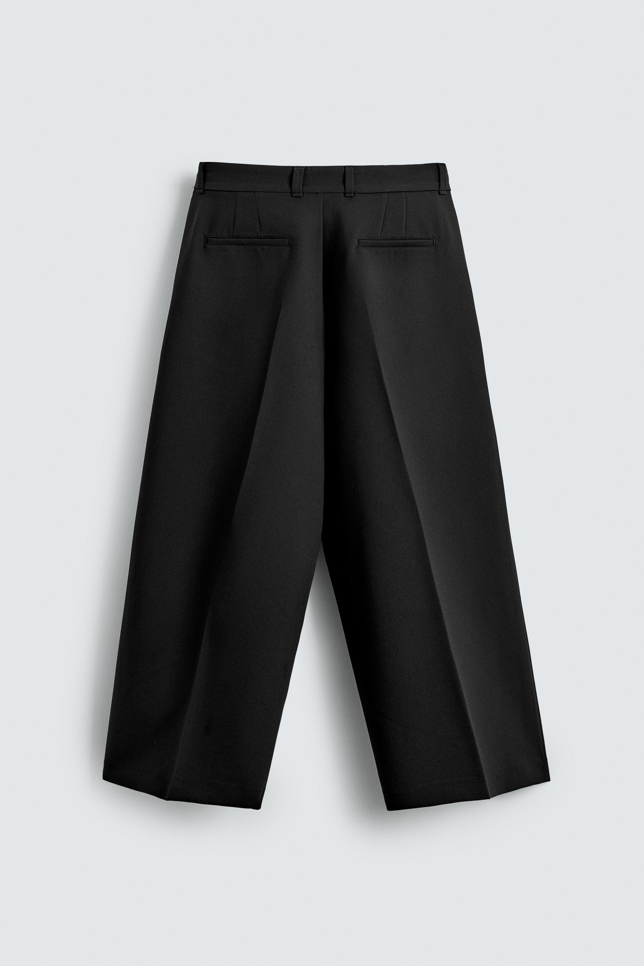 PANTALON COUPE LARGE À PLIS